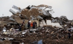 Munkások kutatnak a Plaza Towers általános iskola romjai között az Oklahoma állambeli Moore-ban 2013. május 20-án, miután tornádó pusztított a térségben. A forgószél következtében le Fotó: MTI/AP/Sue Ogrocki